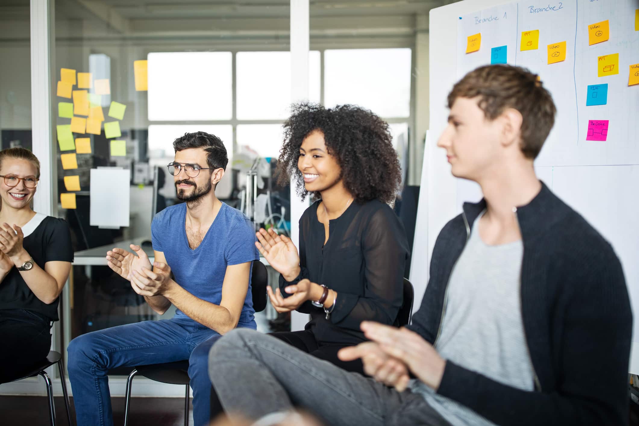 Multi-ethnic business group clapping hands Multi-ethnic business group clapping hands. Men and women clapping after meeting